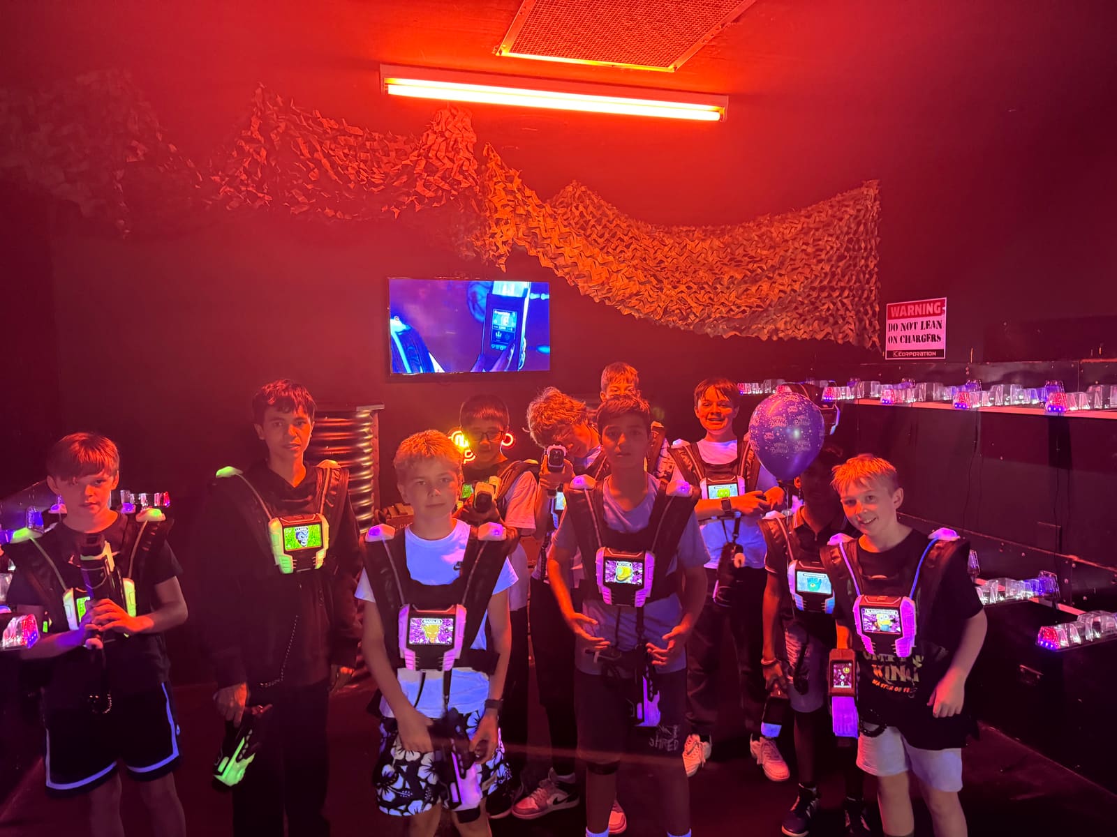 Ethan and his friends in laser tag vests at his birthday party